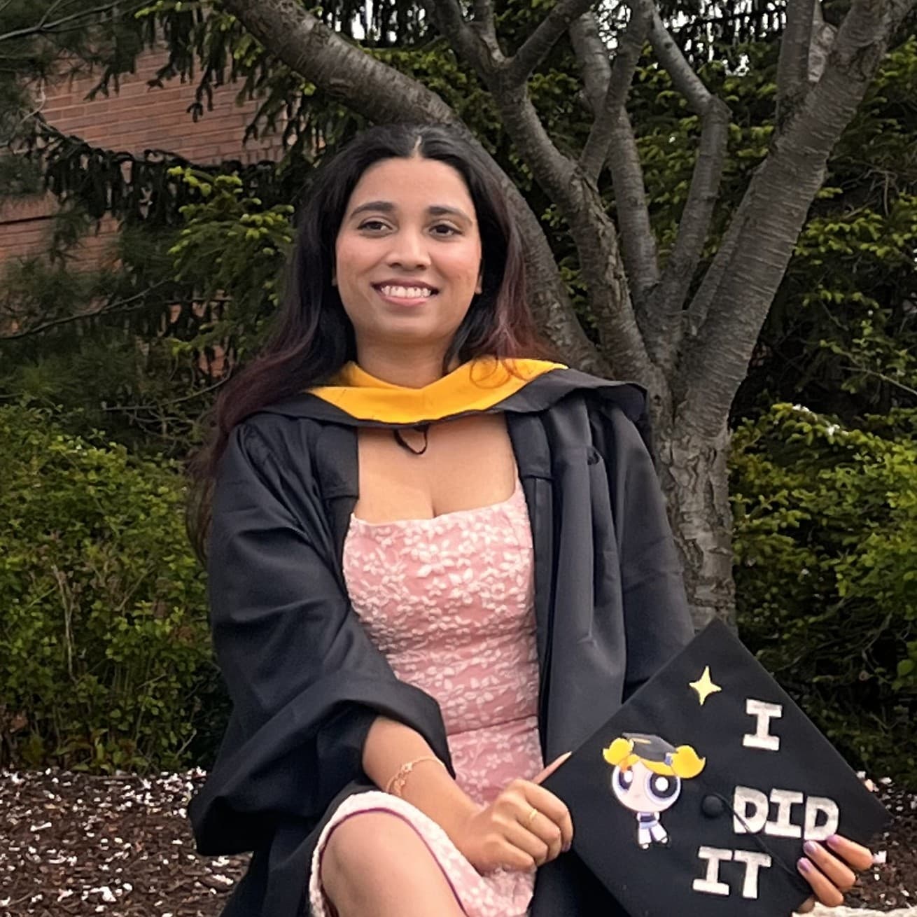 Iyashi at her RIT graduation, in cap and gown